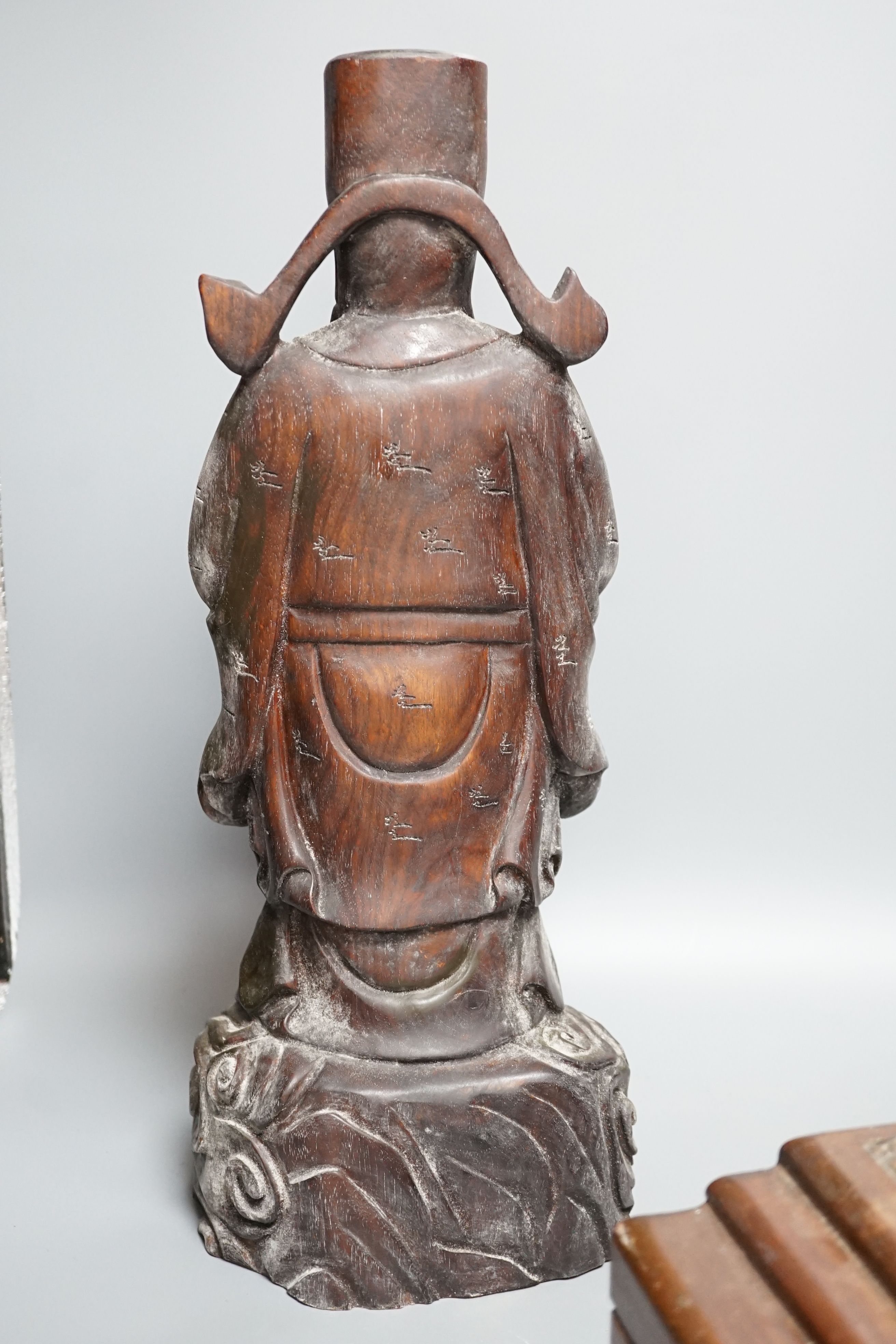 A Chinese carved wood sage and small carved trunk, Sage 47 cms high.
